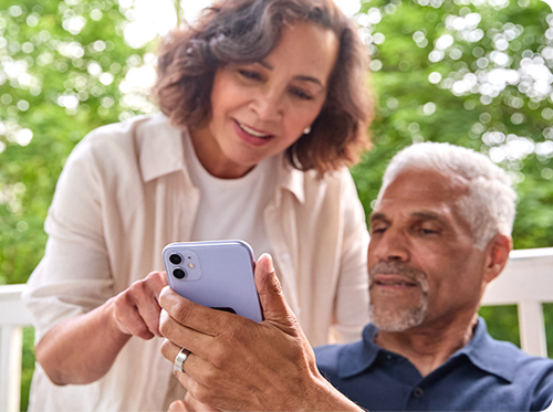 A couple using a cell phone