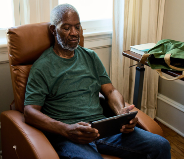 Bob sitting on a chair, waiting for his infusion
