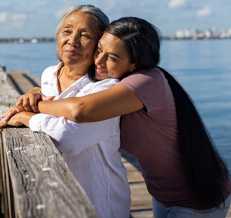 Lola being hugged by her daughter, Nadine